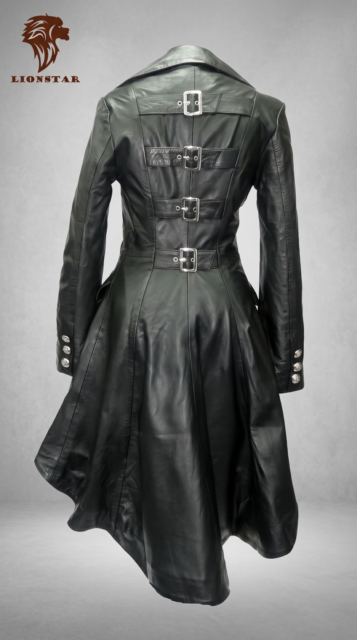 A black Real leather gothic-style long coat with a high collar, shown from the back. The coat features multiple decorative silver-tone buckle details on the back, a belted waist, and buttoned cuffs.